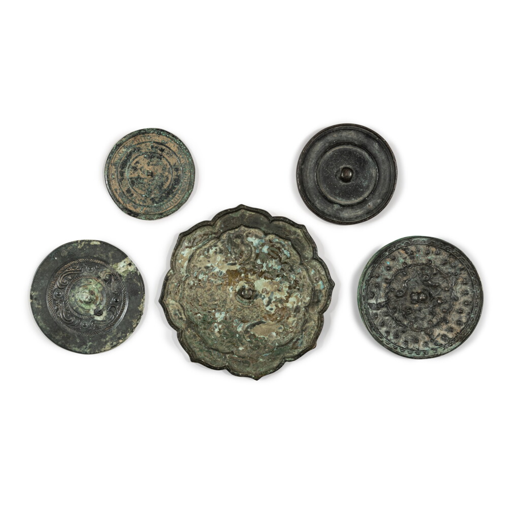 View full screen - View 1 of Lot 893. A group of five bronze mirrors, Warring States period - Tang dynasty | 戰國至唐 銅鏡一組五件.