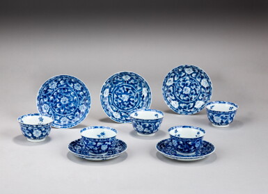 View full screen - View 1 of Lot 17. A group of five blue and white 'flowers' cups and saucers, Qing dynasty, Kangxi period | 清康熙 青花花卉紋盃及小盤一組十件.