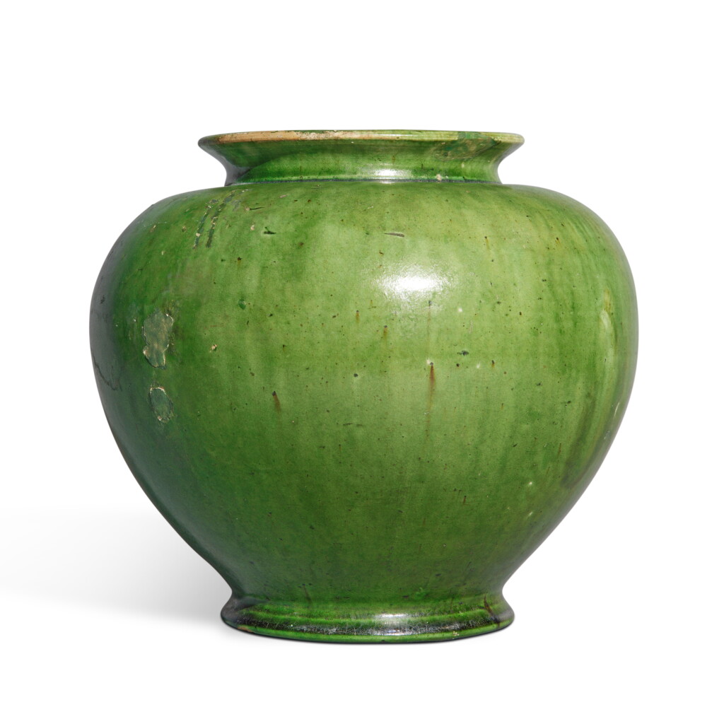 View full screen - View 1 of Lot 667. A green-glazed pottery jar, Tang dynasty | 唐 綠釉罐.