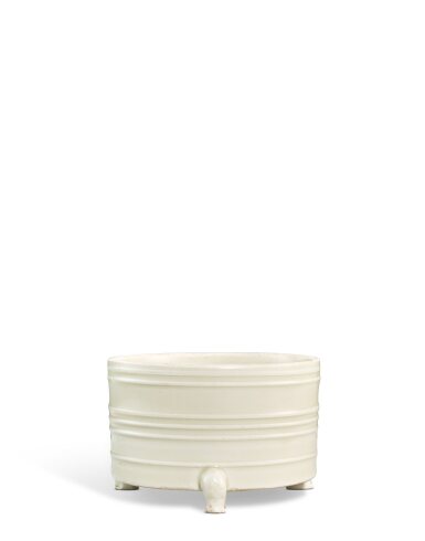View full screen - View 1 of Lot 3669. A Dingyao ribbed cylindrical tripod incense burner, Northern Song dynasty | 北宋 定窰白釉弦紋三足奩式爐.