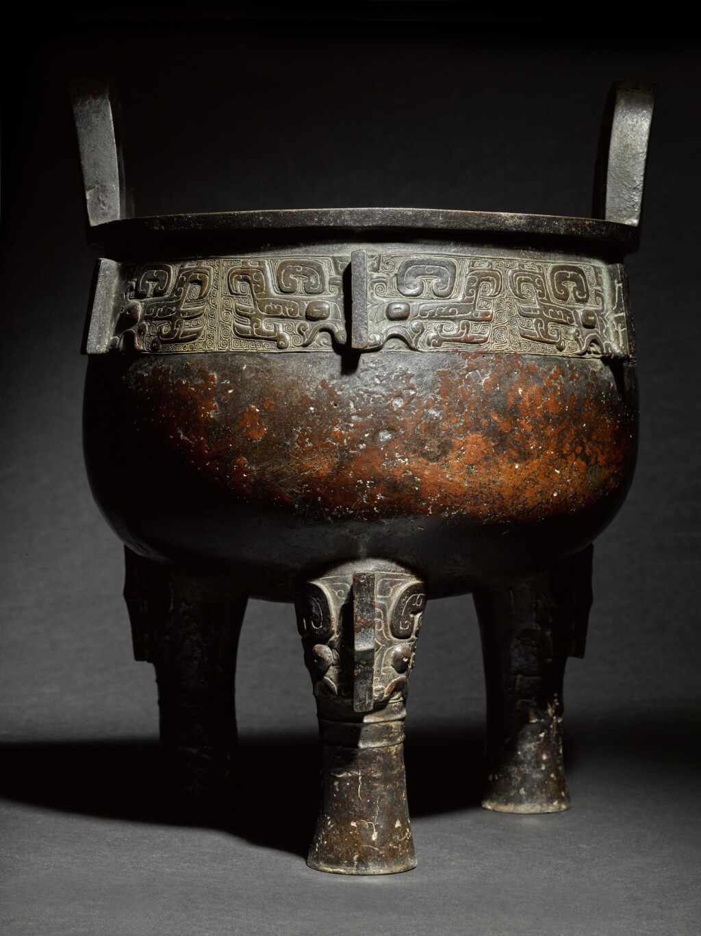 View full screen - View 1 of Lot 94. A monumental and extremely rare archaic bronze ritual food vessel (Ding), Late Shang / early Western Zhou dynasty.