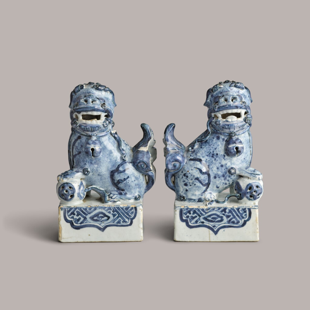 View full screen - View 1 of Lot 348. A pair of blue and white buddhist lions Ming dnyasty, 16th century | 明十六世紀 青花瑞獅戯球擺件一對.