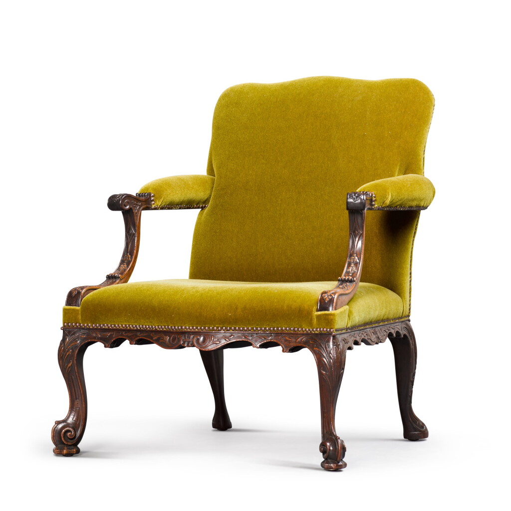 View full screen - View 1 of Lot 126. A GEORGE II STYLE CARVED MAHOGANY GAINSBOROUGH ARMCHAIR, 19TH CENTURY.