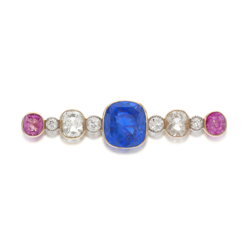 View full screen - View 1 of Lot 1066. Sapphire, pink sapphire, topaz and diamond brooch, circa 1910.