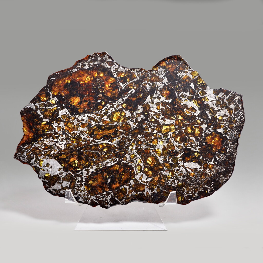 View full screen - View 1 of Lot 150. Complete Slice Of A Seymchan Meteorite — Extraterrestrial Gemstones In Natural Metallic Matrix.