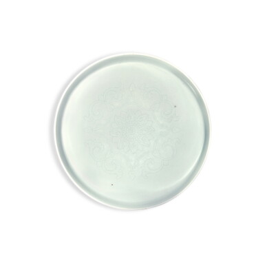 View full screen - View 1 of Lot 211. An incised celadon-glazed ‘lotus’ dish, Qing dynasty .