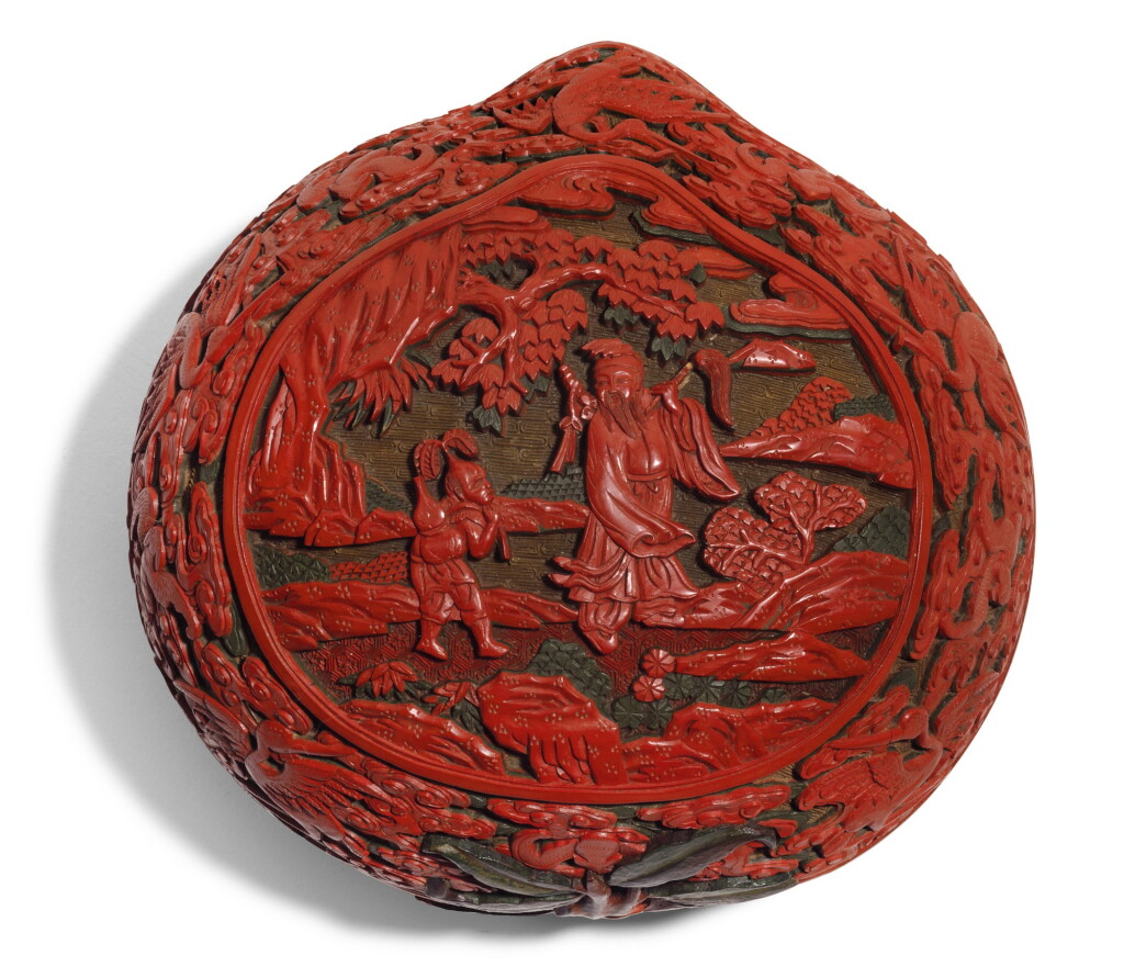 View full screen - View 1 of Lot 140. A CARVED POLYCHROME LACQUER BOX AND COVER QING DYNASTY, QIANLONG PERIOD | 清乾隆 剔彩神仙圖桃式蓋盒.