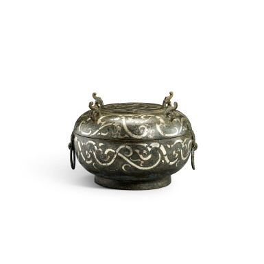View full screen - View 1 of Lot 525. An inscribed silver-inlaid bronze ritual food vessel and cover, dui, Eastern Zhou dynasty, Warring States period 東周戰國 銅錯銀「丙子」龍紋敦.