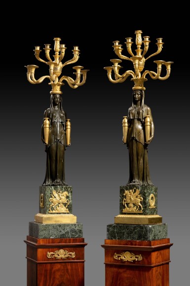 View full screen - View 1 of Lot 27. A pair of Empire patinated and gilt-bronze twelve-light candelabra, probably by André-Antoine Ravrio, Paris, circa 1800-1805.