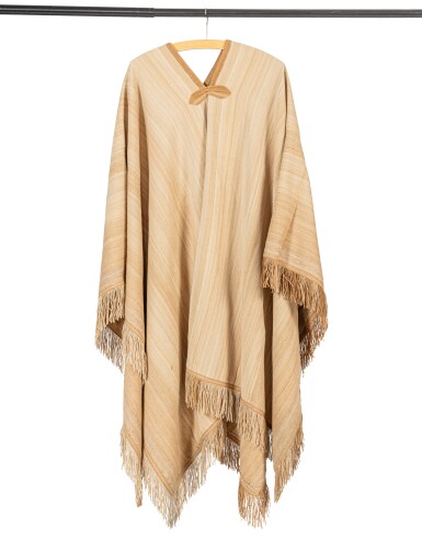 View full screen - View 1 of Lot 49. Two fringed ponchos and a black hat that belonged to Yul Brynner.