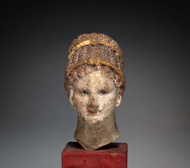 View full screen - View 1 of Lot 218. A Hellenistic Polychrome Terracotta Head of a Girl, circa 3rd century B.C..