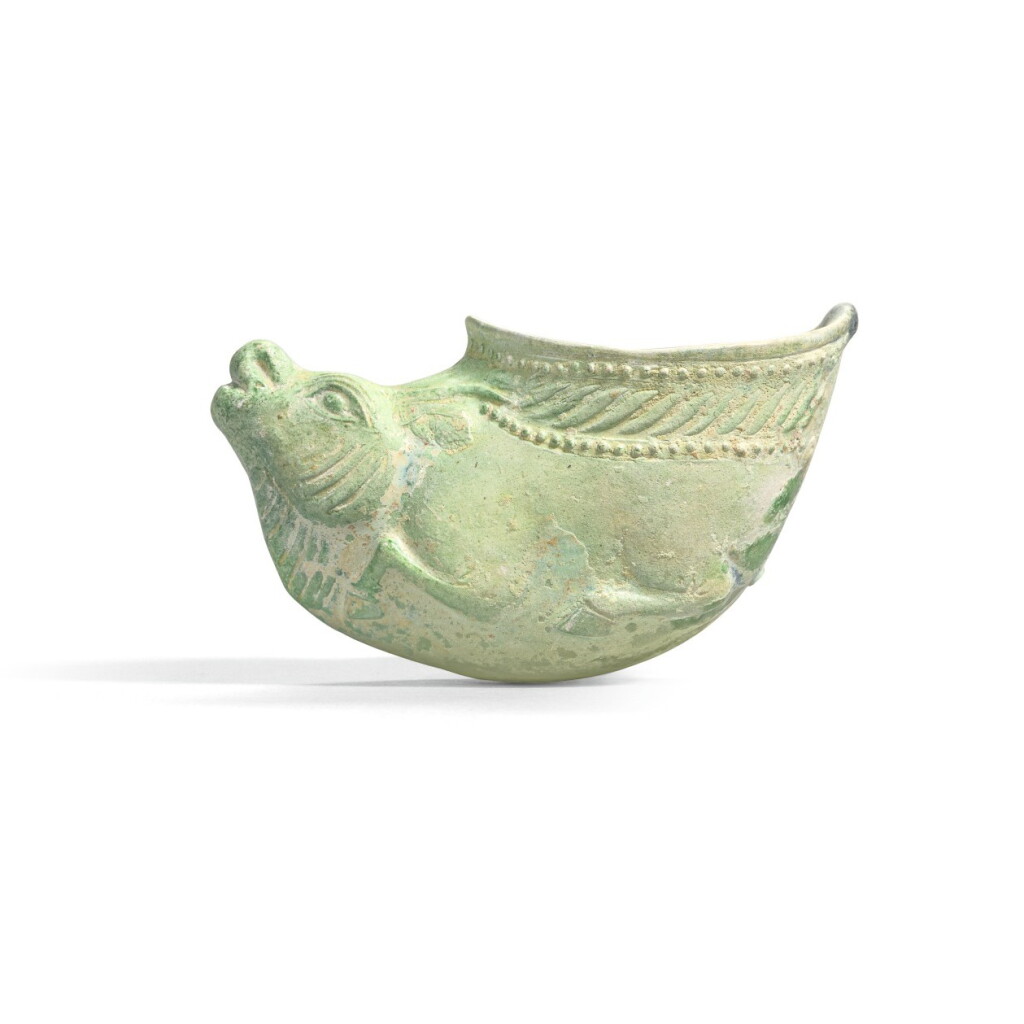 View full screen - View 1 of Lot 221. A RARE SMALL GREEN-GLAZED 'BUFFALO' RHYTON, SUI/TANG DYNASTY | 隋/唐 綠釉牛首盃.