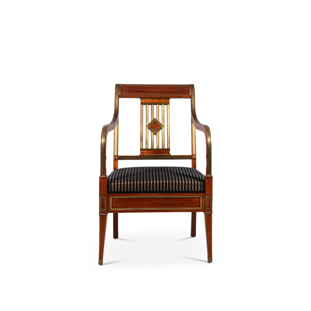View full screen - View 1 of Lot 149. A Russian Neoclassical gilt-brass mahogany and mahogany veneered armchair, early 19th century.