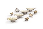 A set of four French silver shell dishes, circa 1850, a set of four Victorian silver salt cellars, London, 1841 and a silver shell dish, London, 1909