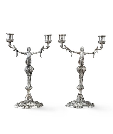 View full screen - View 1 of Lot 118. A pair of Irish silver two-light candelabra with slave motifs, John Letablere, Dublin, 1737-1754 | Paire de chandeliers à 2 lumières à décor d'esclave en argent par John Letablere, Dublin, 1737-1754.