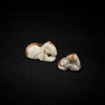 Two celadon and russet jade horses, Ming dynasty 明 青玉臥馬兩件