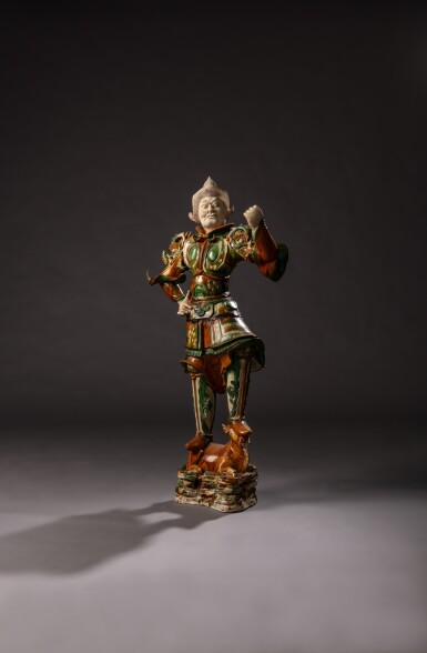 View full screen - View 1 of Lot 59. A large sancai-glazed pottery figure of a Lokapala, Tang dynasty | 唐 三彩天王立像 .