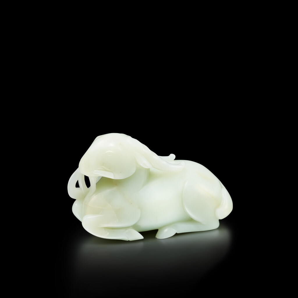 View full screen - View 1 of Lot 3659. A large white jade figure of a ram, Qing dynasty, 18th century | 清十八世紀 白玉臥羊銜穗.