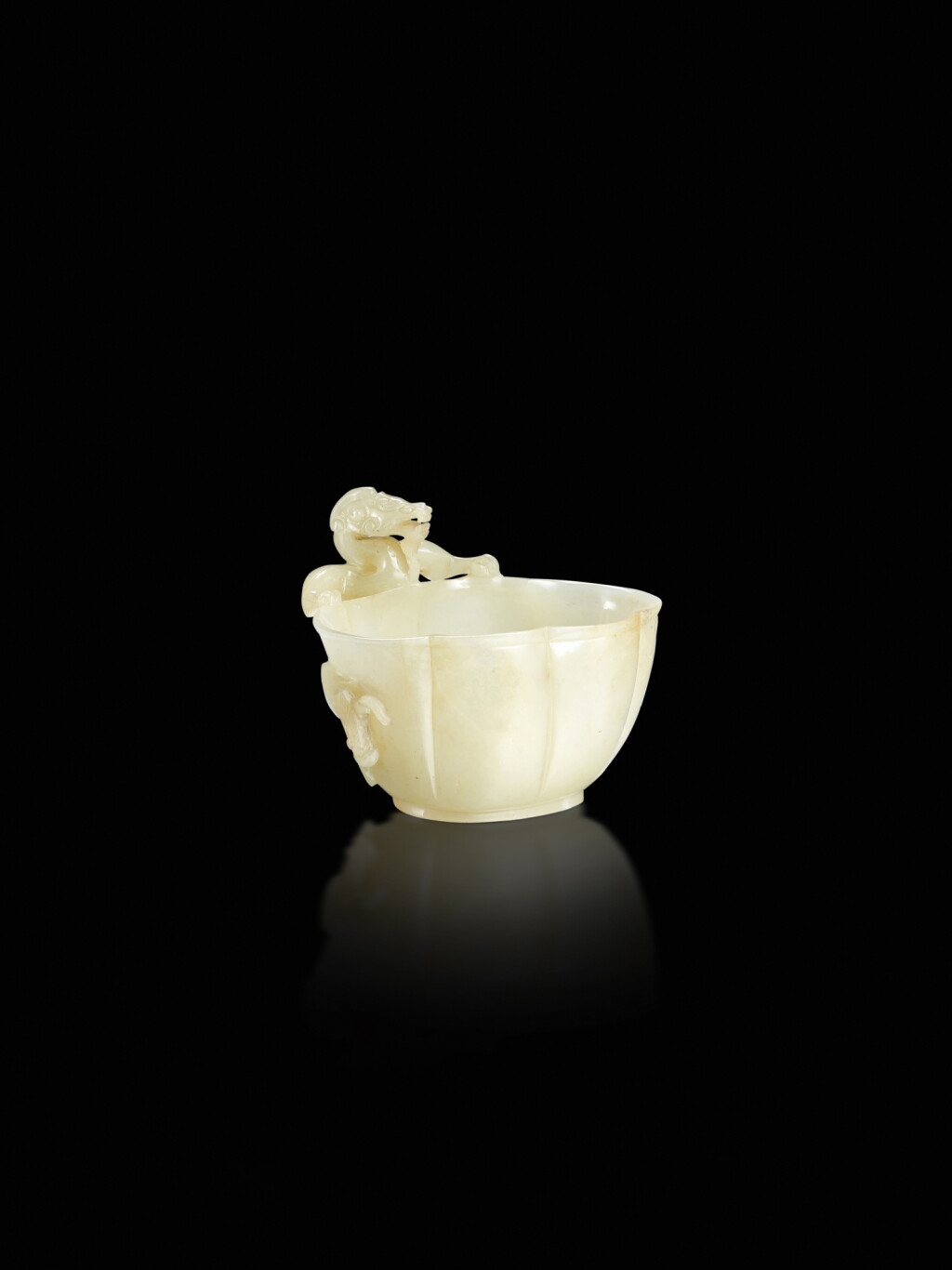 View full screen - View 1 of Lot 100. A pale celadon jade 'chilong' lobed cup, Yuan dynasty.