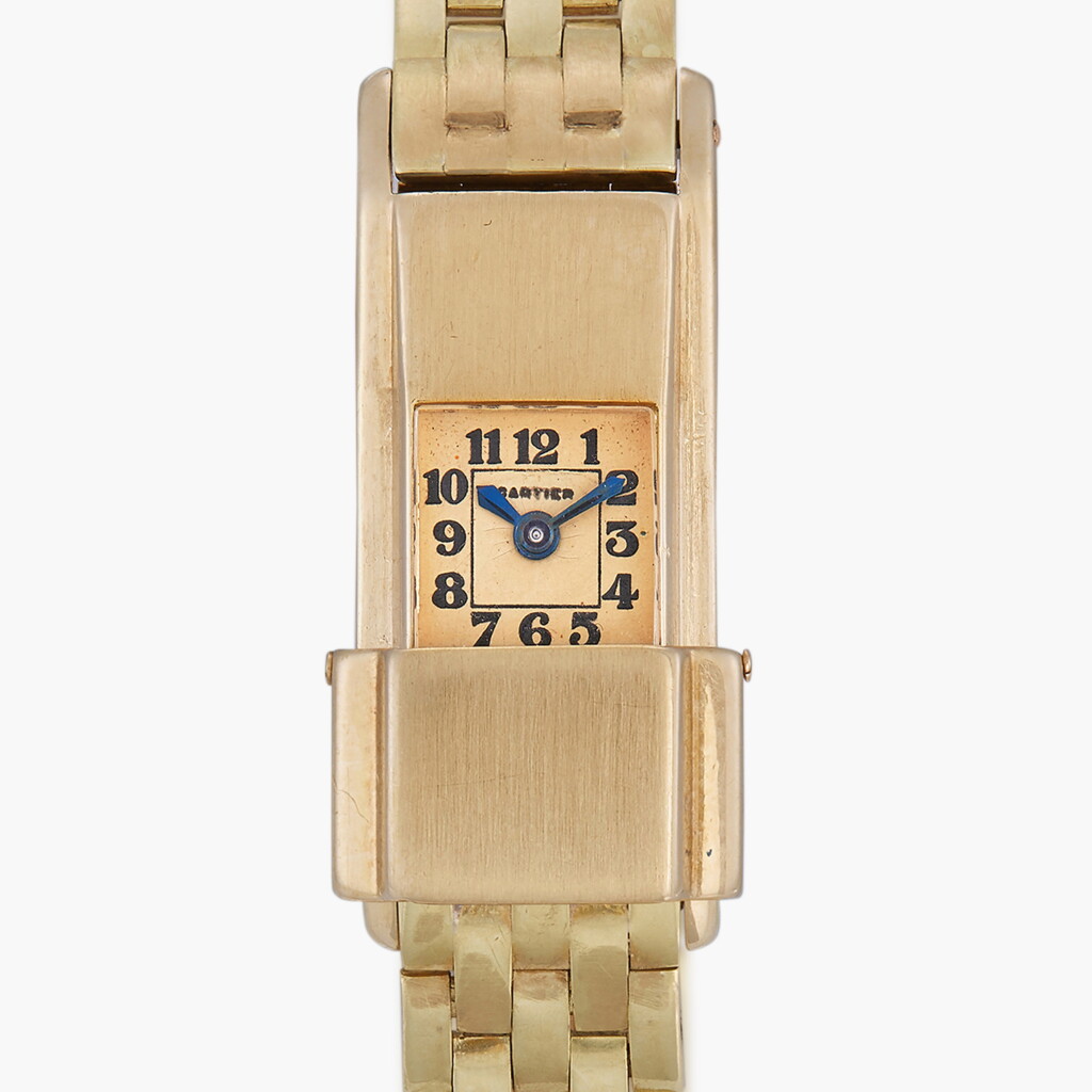 View full screen - View 1 of Lot 121. An unusual rectangular lady’s rear-wound wristwatch with sliding protective dial cover and original gold bracelet and deployant buckle | Circa 1933.