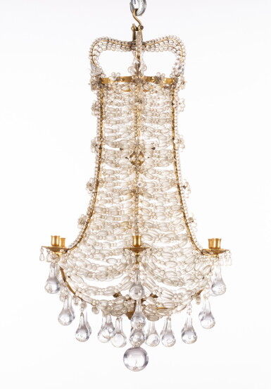 View full screen - View 1 of Lot 129. A pair of gilt-metal and glass six-light chandelier, Louis XIV style, 20th century | Paire de lustres à lacé à six lumières en métal doré et verre de style Louis XIV, XXe siècle.