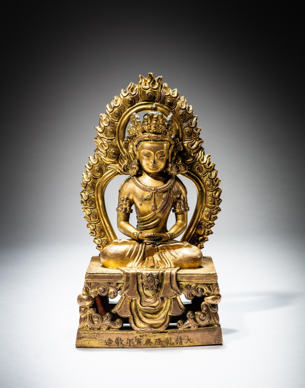 View full screen - View 1 of Lot 59. A gilt-bronze figure of Amitayus, Mark and period of Qianlong, dated gengyin year, corresponding to 1770 | 清乾隆庚寅年(1770年) 鎏金銅無量壽佛坐像.