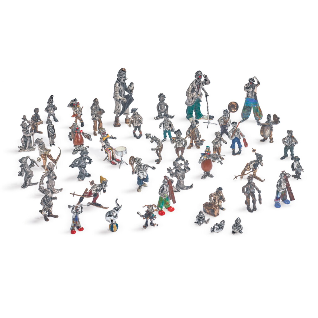 View full screen - View 1 of Lot 884. A GROUP OF FORTY-THREE ITALIAN SILVER AND ENAMEL CLOWNS, ARREZO, LATE 20TH CENTURY.