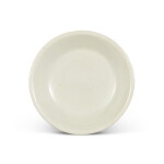 A Jingxian white-glazed lobed dish, Five dynasties | 五代 涇縣窰白釉葵瓣口盤