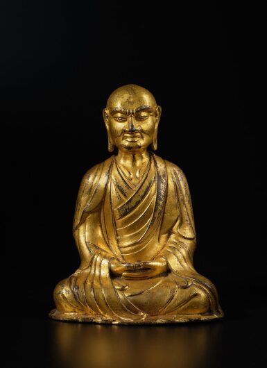 View full screen - View 1 of Lot 127. A gilt-bronze figure of Kasyapa, Liao Dynasty | 遼 銅鎏金迦葉尊者坐像.