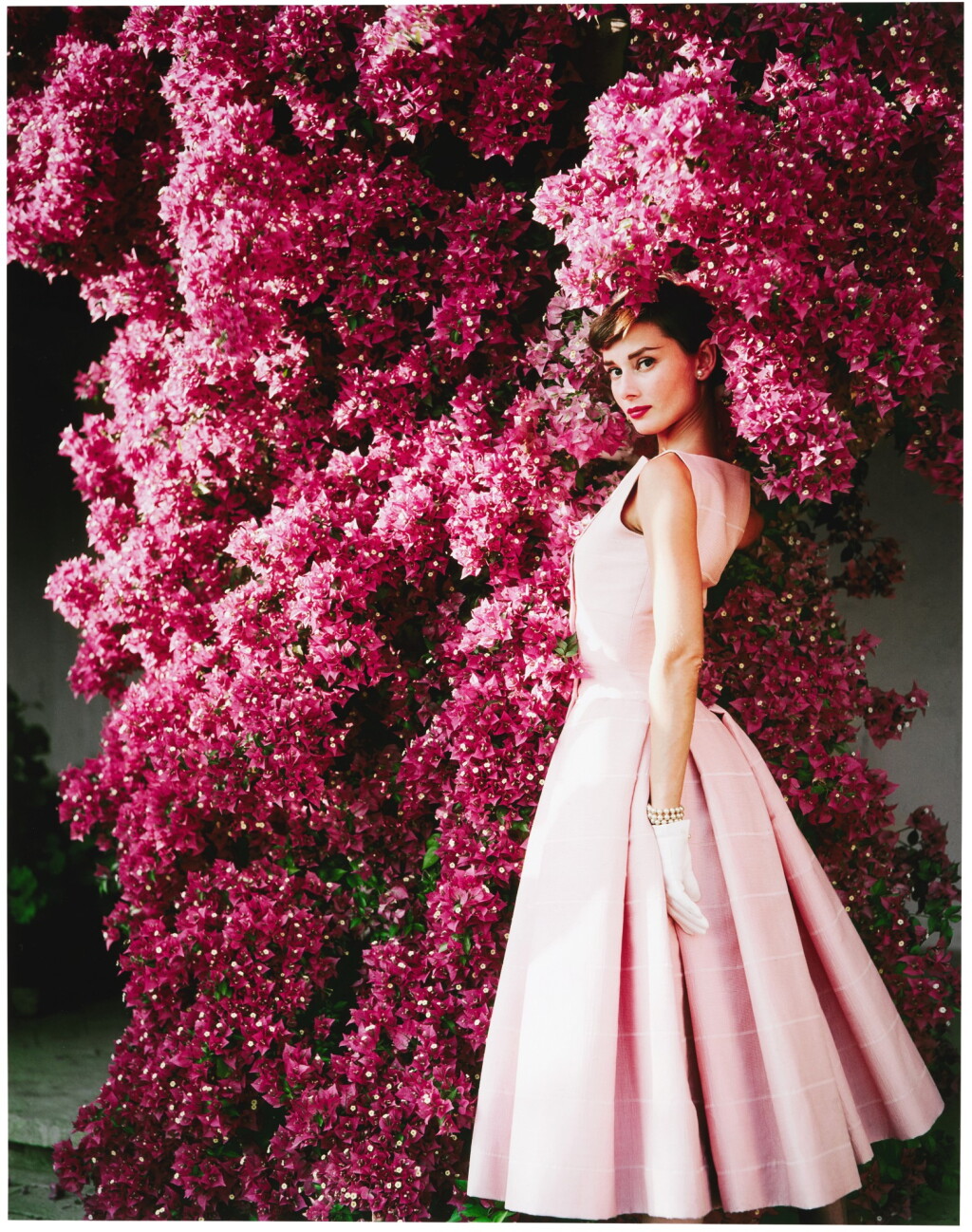 View full screen - View 1 of Lot 47. NORMAN PARKINSON | AUDREY HEPBURN WITH FLOWERS II, 1955.