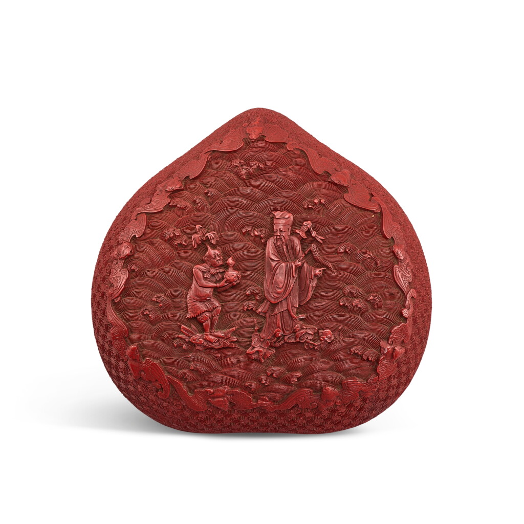View full screen - View 1 of Lot 557. A cinnabar lacquer 'immortal' peach-shaped box and cover, Qing dynasty, 18th century 清十八世紀 剔紅呂洞賓圖桃式蓋盒.