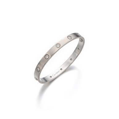 View full screen - View 1 of Lot 1133. Gold and diamond bangle, 'Love'.