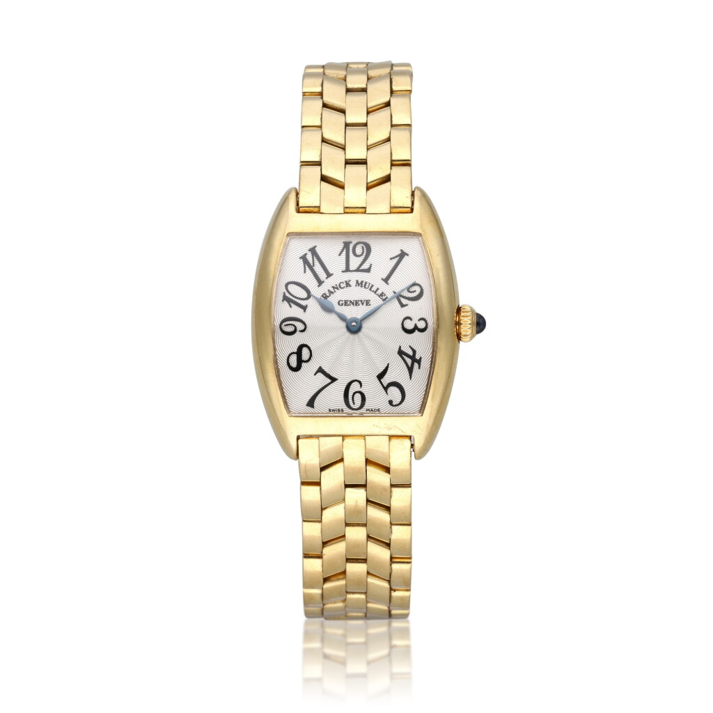 View full screen - View 1 of Lot 338. Reference 2250 QZ | A yellow gold tonneau shaped bracelet watch, Circa 2000.