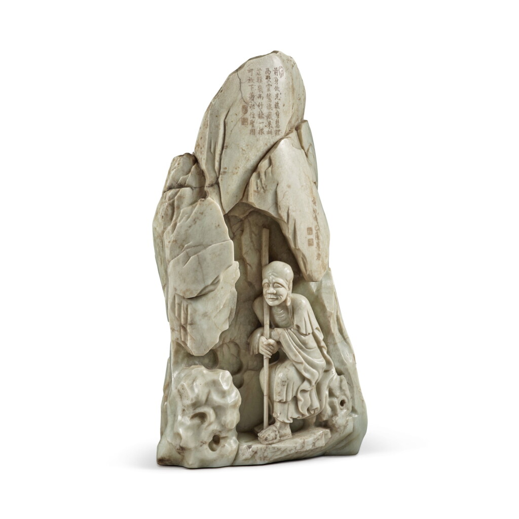 View full screen - View 1 of Lot 24. A large and important imperially inscribed pale green jade 'luohan' boulder, Qing dynasty, Qianlong period | 清乾隆 青玉雕嘎納嘎巴薩尊者山子 .