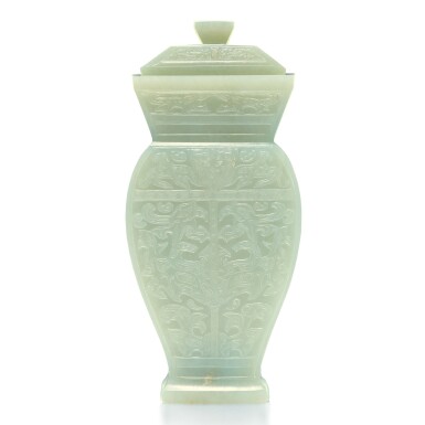 View full screen - View 1 of Lot 19. An archaistic celadon jade baluster vase and cover, Qing dynasty, 19th century | 清十九世紀 青玉雕仿古饕餮紋蓋瓶.