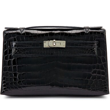 View full screen - View 1 of Lot 1394. Black Shiny Niloticus Crocodile Kelly Pochette Palladium Hardware, 2012.