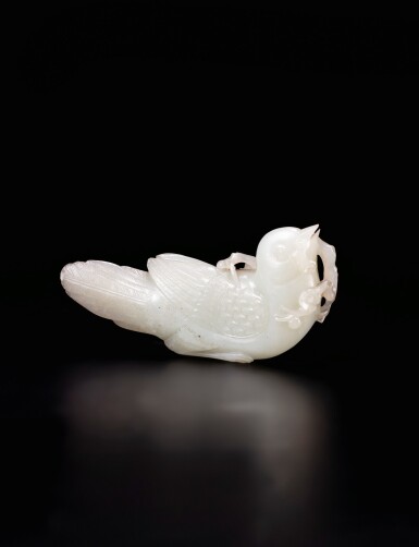 View full screen - View 1 of Lot 5. A pale celadon jade songbird Qing dynasty, Qianlong period | 清乾隆 青白玉鳥把件.