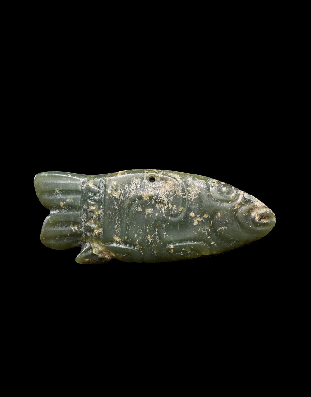 View full screen - View 1 of Lot 942. A green jade 'fish' pendant, Neolithic period, Hongshan culture | 新石器時代紅山文化 玉魚.