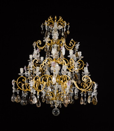 View full screen - View 1 of Lot 92. A French rock crystal and gilt-iron sixteen-light chandelier, in 18th century style.
