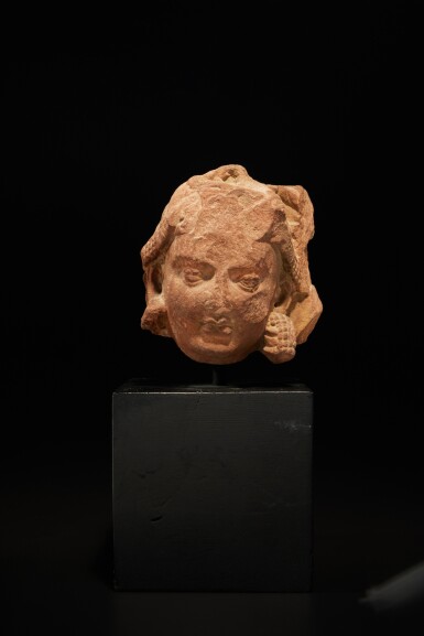 View full screen - View 1 of Lot 156. A mottled red sandstone Yakshini head, Central India, Mathura, 2nd century.