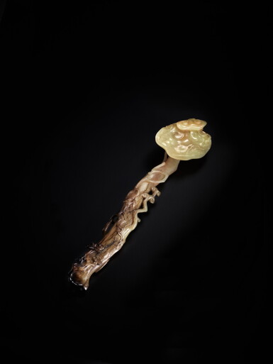 View full screen - View 1 of Lot 216. A yellow and russet jade ruyi scepter, Qing dynasty | 清 黃玉雕靈芝如意.