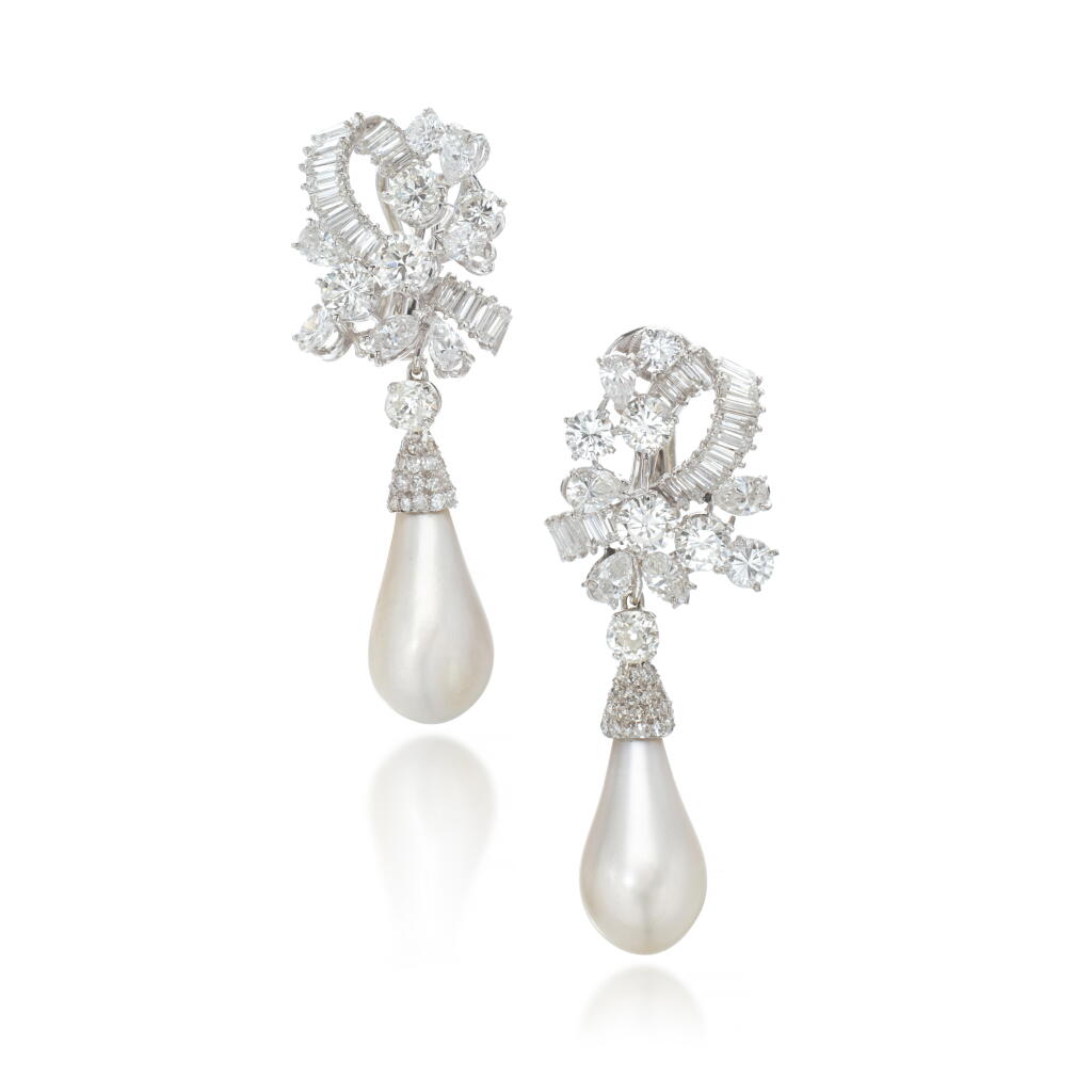 View full screen - View 1 of Lot 605. Fine pair of natural pearl and diamond pendent ear clips, circa 1960.