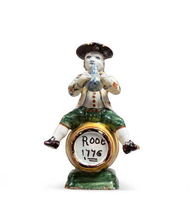 View full screen - View 1 of Lot 10. A Dutch Delft style polychrome faience figure of a wee man seated on a barrel | Figure d'homme assis sur un tonneau en faïence de Delft.