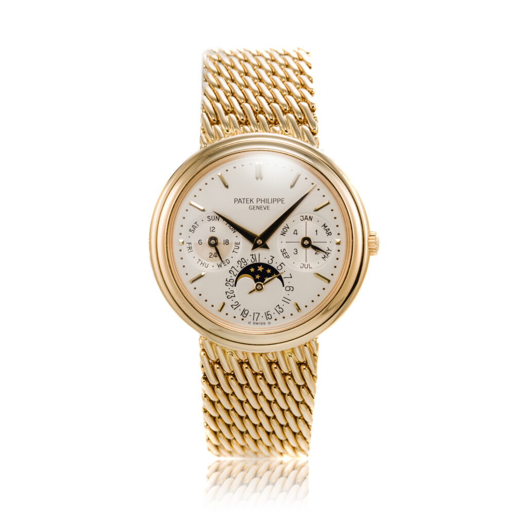 View full screen - View 1 of Lot 136. Reference 3945 | A yellow gold automatic perpetual calendar moon phase bracelet watch, Circa 1991 | "百達翡麗 3945 | 型號 黃金自動上鏈萬年曆鍊帶腕錶備月相顯示,約1991年製".