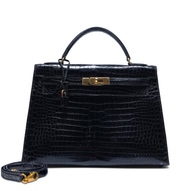 View full screen - View 1 of Lot 142. Vintage Black Shiny Porosus Crocodile Kelly 32 Sellier Gold Hardware, 1990.