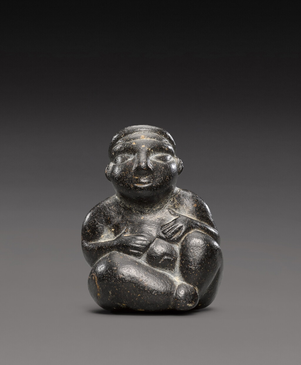 View full screen - View 1 of Lot 202. An Anatolian Black Steatite Figure of a Goddess, 6th/5th Millennium B.C..