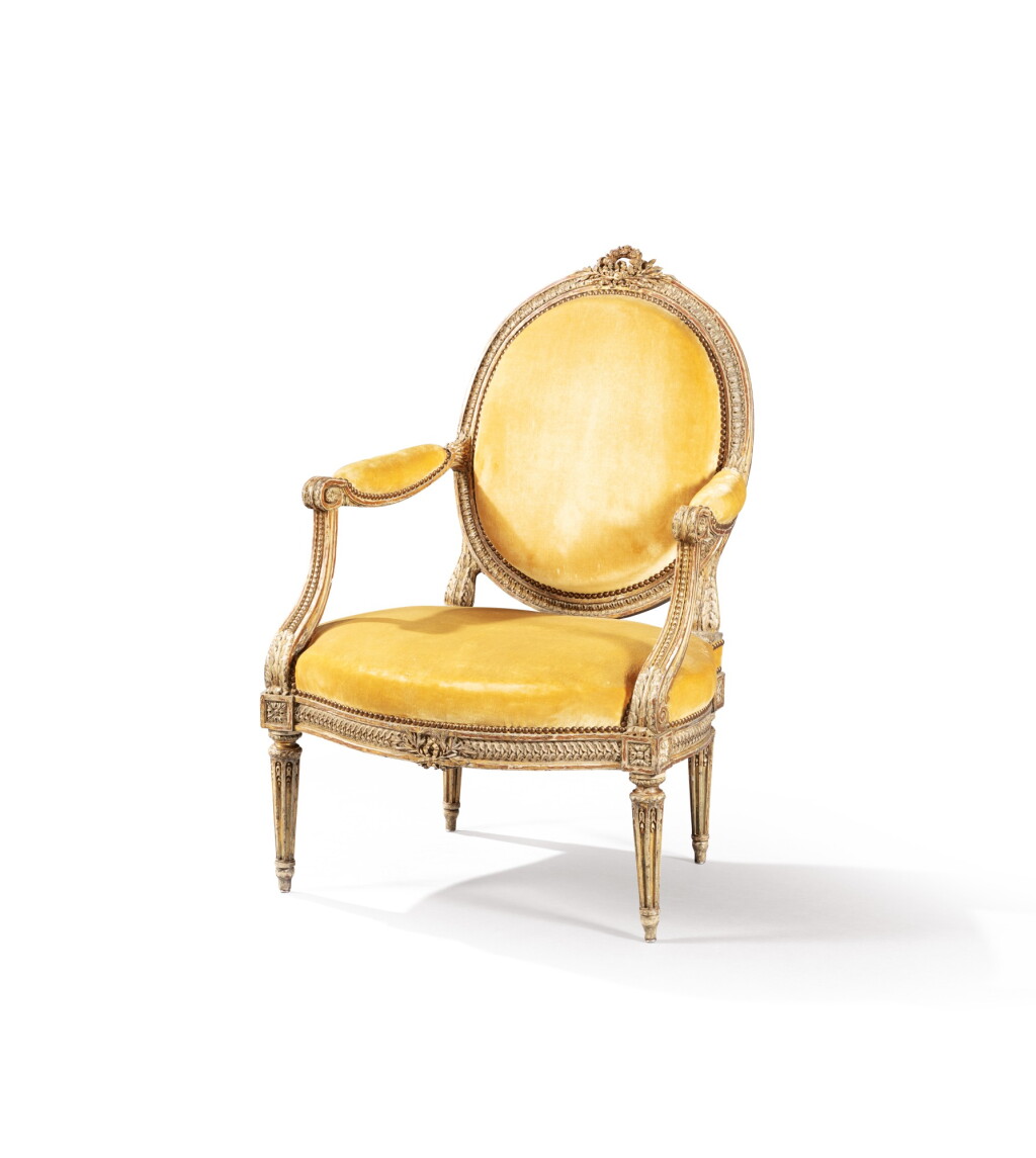 View full screen - View 1 of Lot 105. A Louis XVI parcel-gilt walnut armchair, stamped I. B. LELARGE circa 1780 | Fauteuil à dossier à la reine en noyer mouluré et sculpté partiellement doré d'époque Louis XVI, estampillé I. B. LELARGE, vers 1780.