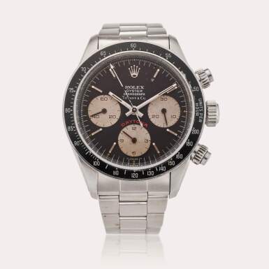 View full screen - View 1 of Lot 677. Reference 6263 Daytona 'Big Red' | Retailed by Tiffany & Co.: A stainless steel chronograph wristwatch with bracelet, Circa 1983.