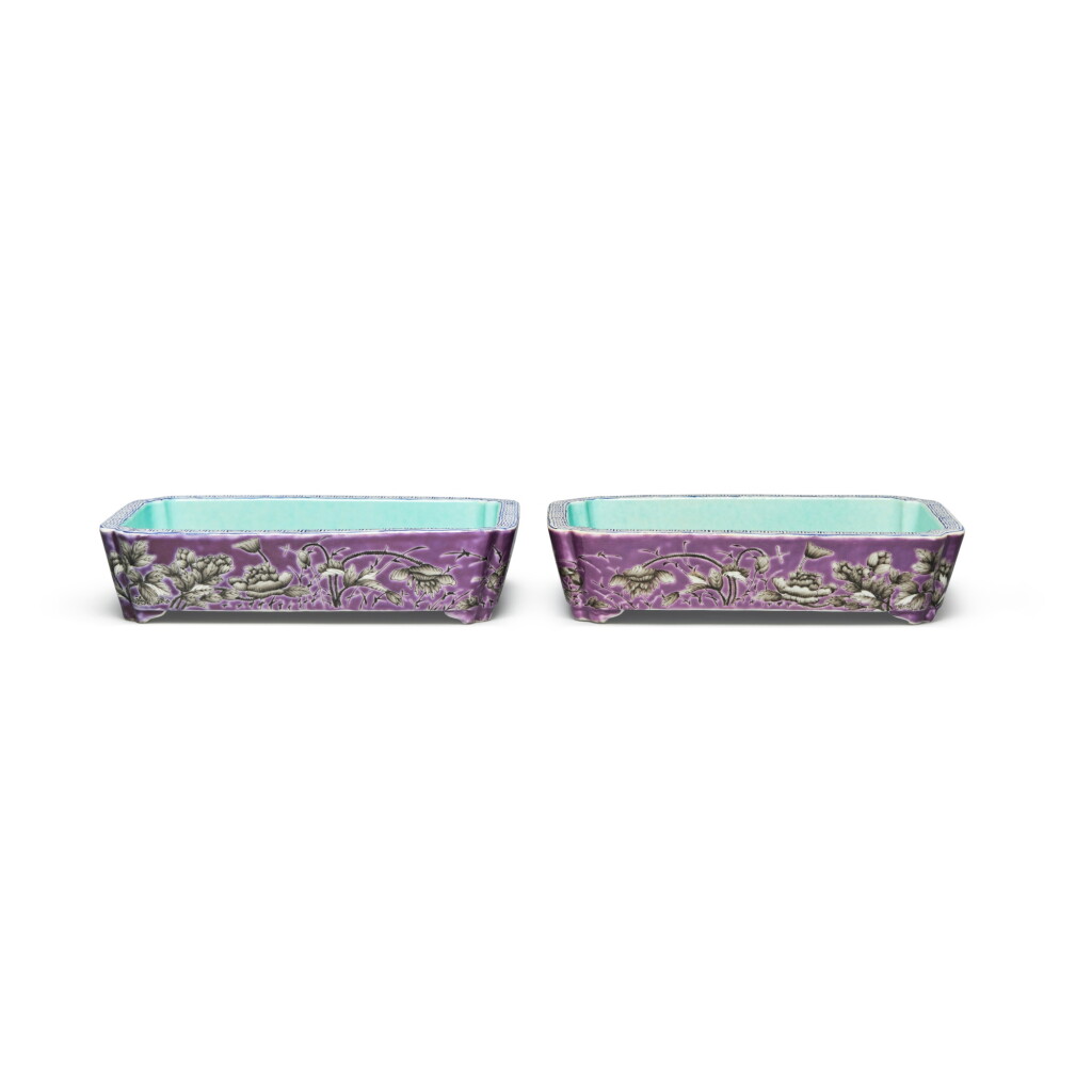 View full screen - View 1 of Lot 585. A pair of purple-ground grisaille-painted 'Dayazhai' 'peony' rectangular narcissus trays, Qing dynasty, Guangxu period, circa 1876 | 清光緒 約1876年 紫地墨彩牡丹紋長方水仙盆一對 《大雅齋》《天地一家春》《永慶長春》款.