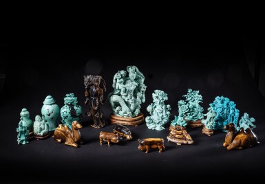 View full screen - View 1 of Lot 284. A study collection of nineteen turquoise and tiger's eye carvings, 20th century.